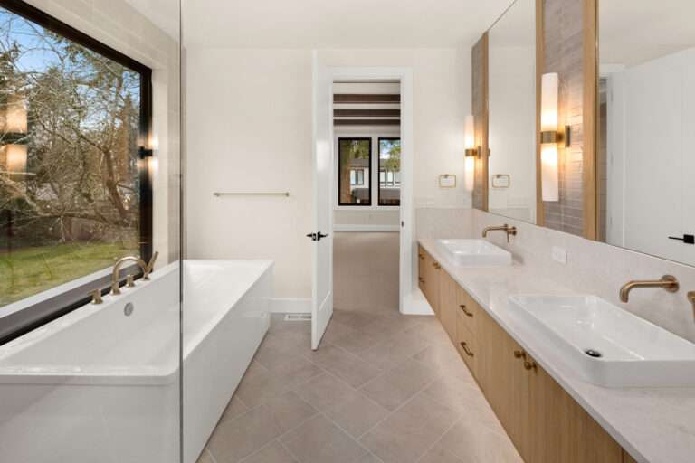 Brentwood custom floor plan primary suite bath vanity and tub