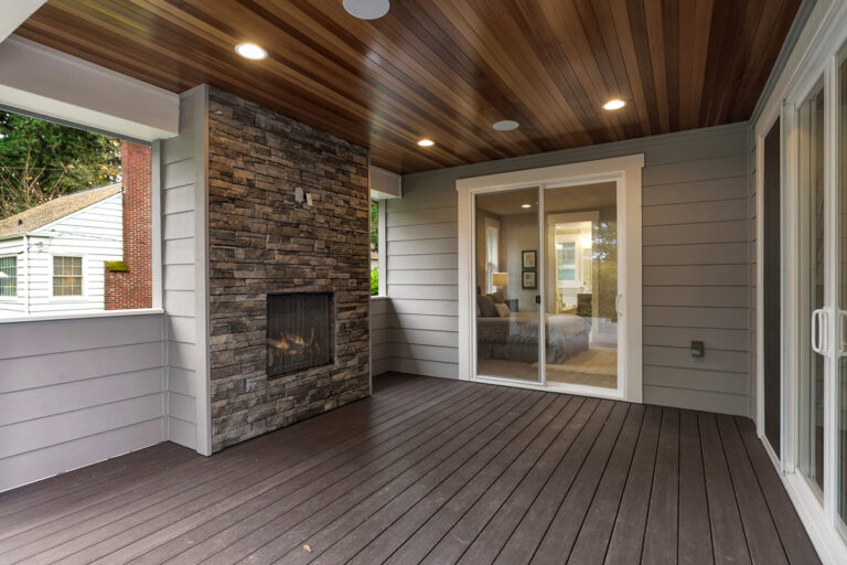 Calabria custom floor plan covered deck with fireplace